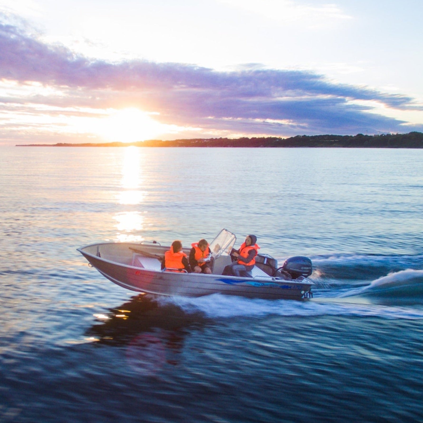 people on board a powerboat training for their NSW powerboat licence