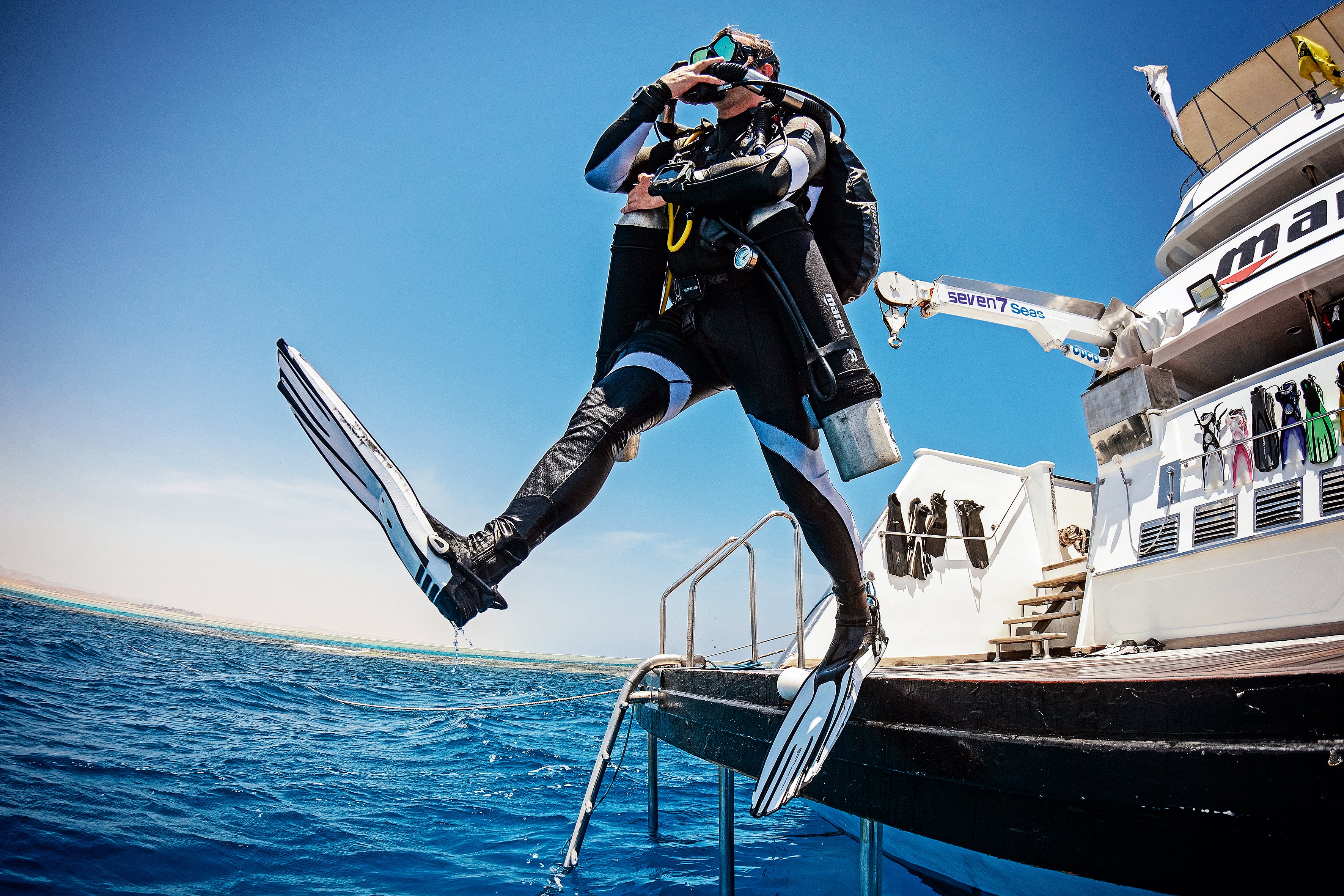 diver entering water using giant stride entry